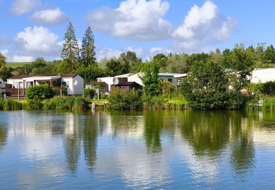 Row of single-wide manufactured homes on their lots